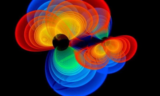 黑洞合併的產生引力波的模擬圖片